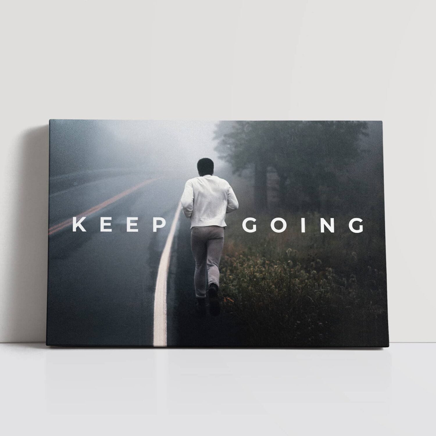 Muhammad Ali canvas featuring the legendary boxer out jogging and the quote "Keep Going".